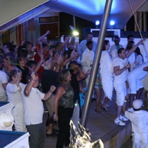 Gio entertaining the crowd at Norwegian Sky's White Hot Party