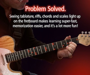 Learn to play a guitar with Fretlight Guitar