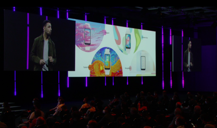 Honor's smartwatches on a large screen above the stage